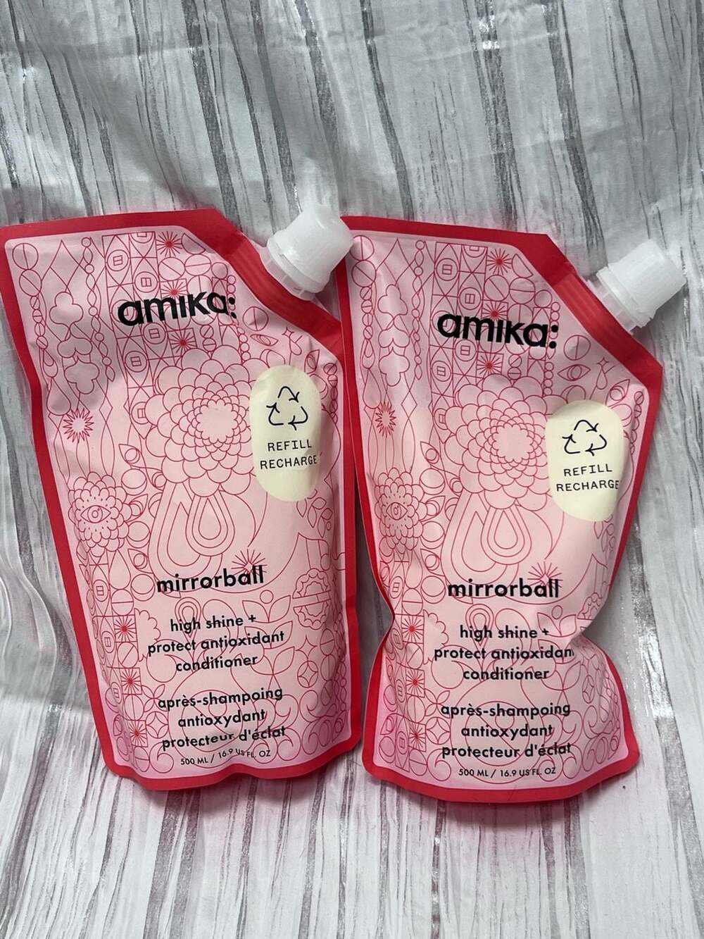 Two (2) 16.9oz will refill your liter Amika